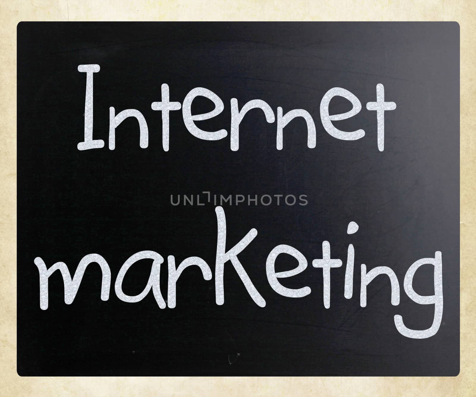 "Internet marketing" handwritten with white chalk on a blackboard