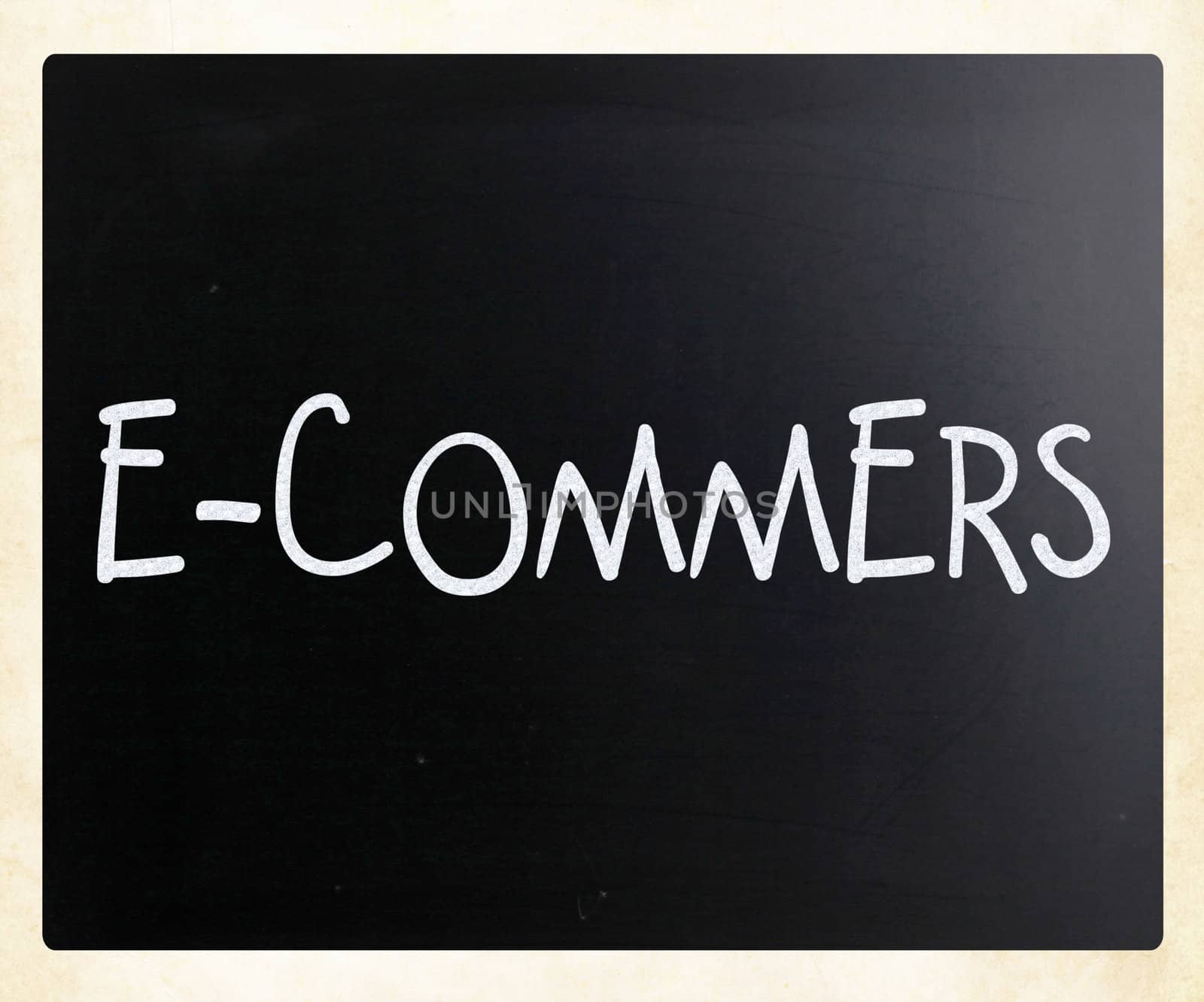 The word "E-commers" handwritten with white chalk on a blackboard