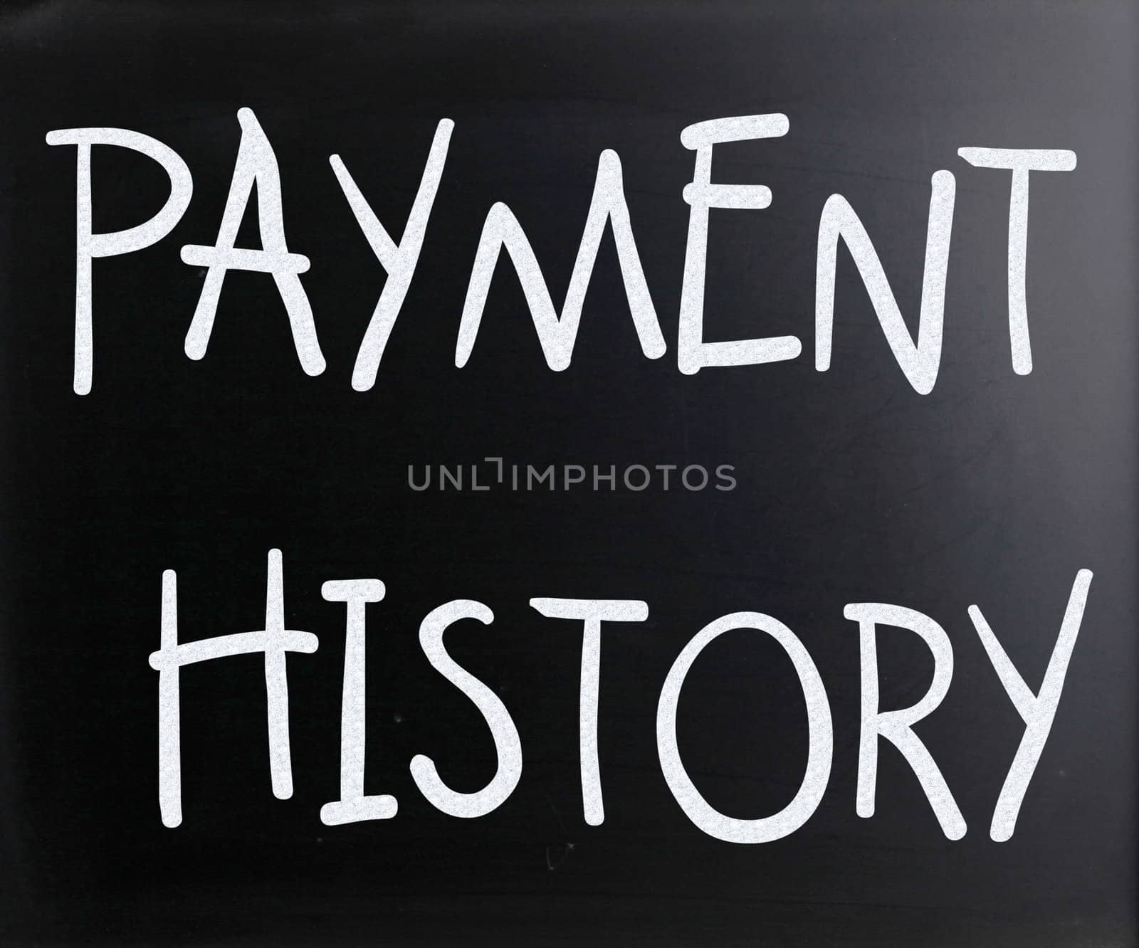 "Payment history" handwritten with white chalk on a blackboard