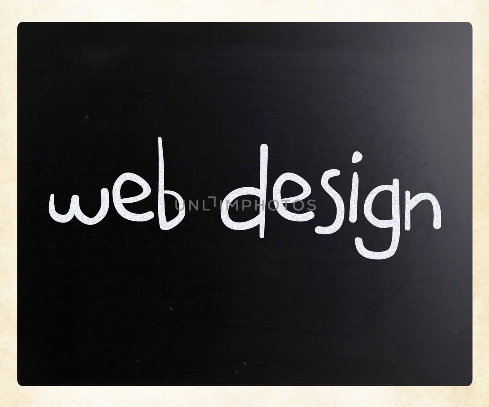 "Web design" handwritten with white chalk on a blackboard
