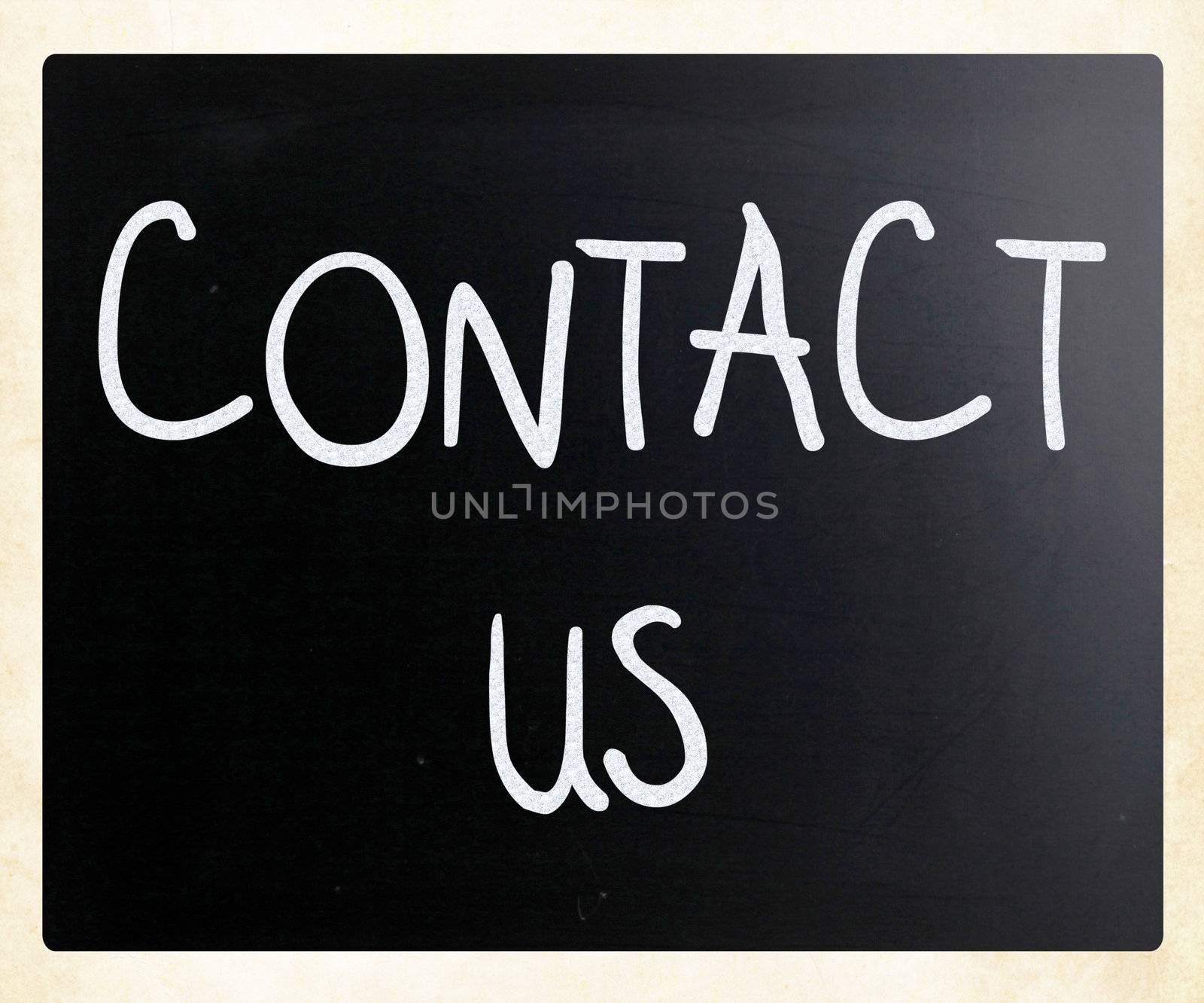 "Contact Us" handwritten with white chalk on a blackboard