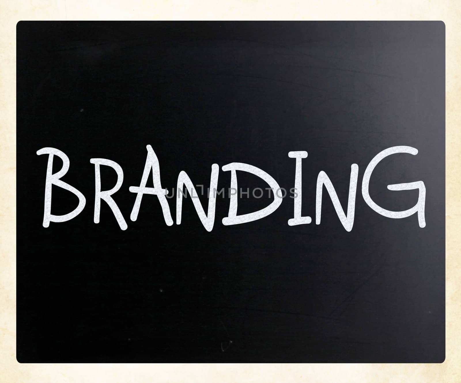 "Branding" handwritten with white chalk on a blackboard