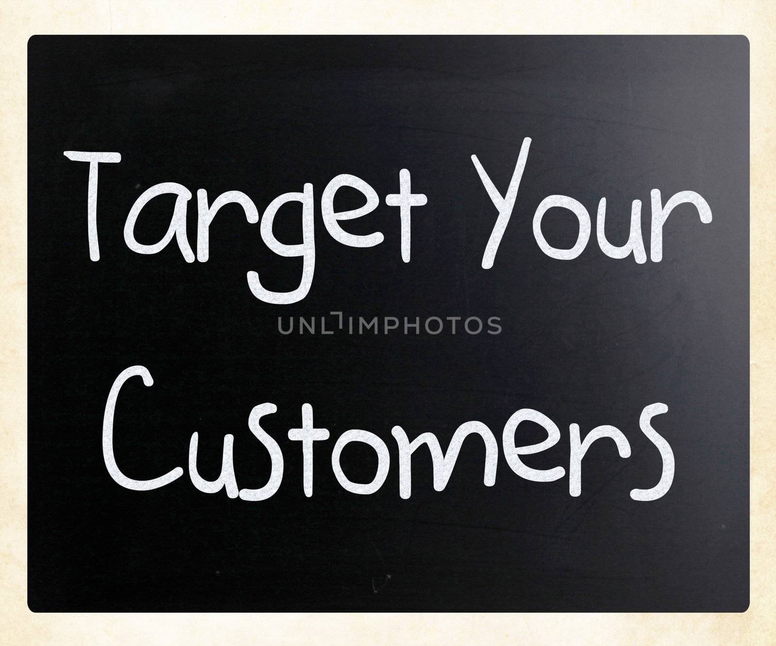 "Target your customers" handwritten with white chalk on a blackboard