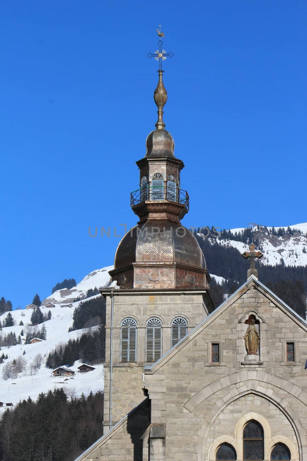 Tower of the Church Notre Dame de l'Assomption in winter, Grand-Bornant, France