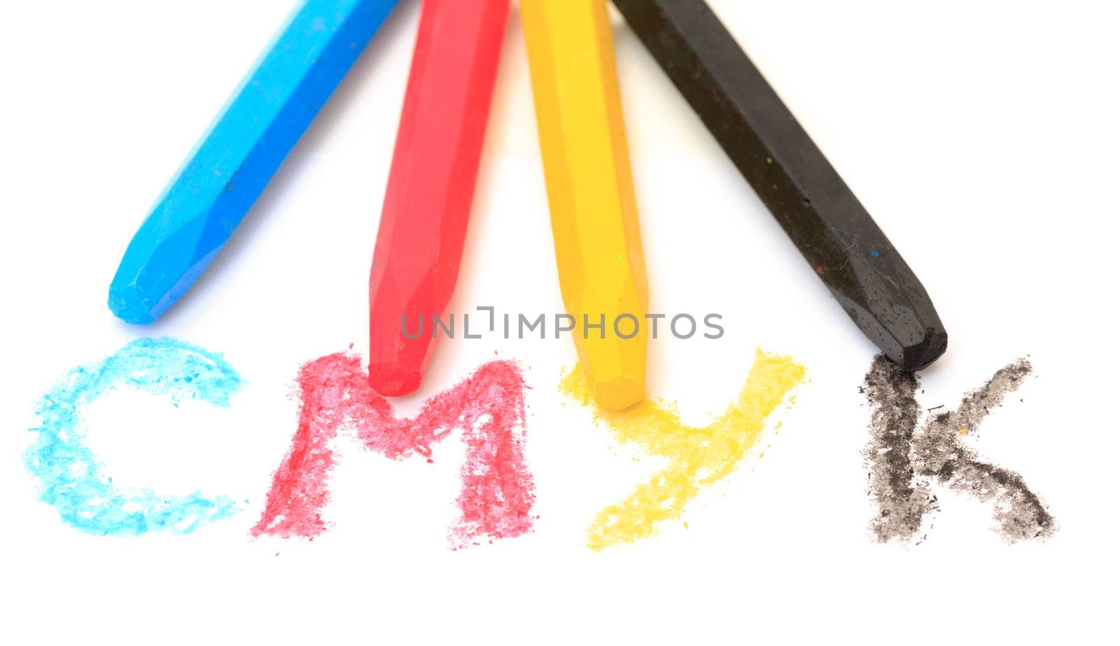 Sign of the CMYK from pastel crayons on white