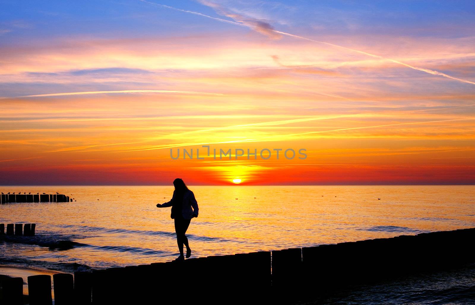 Woman silhouette in the sunse