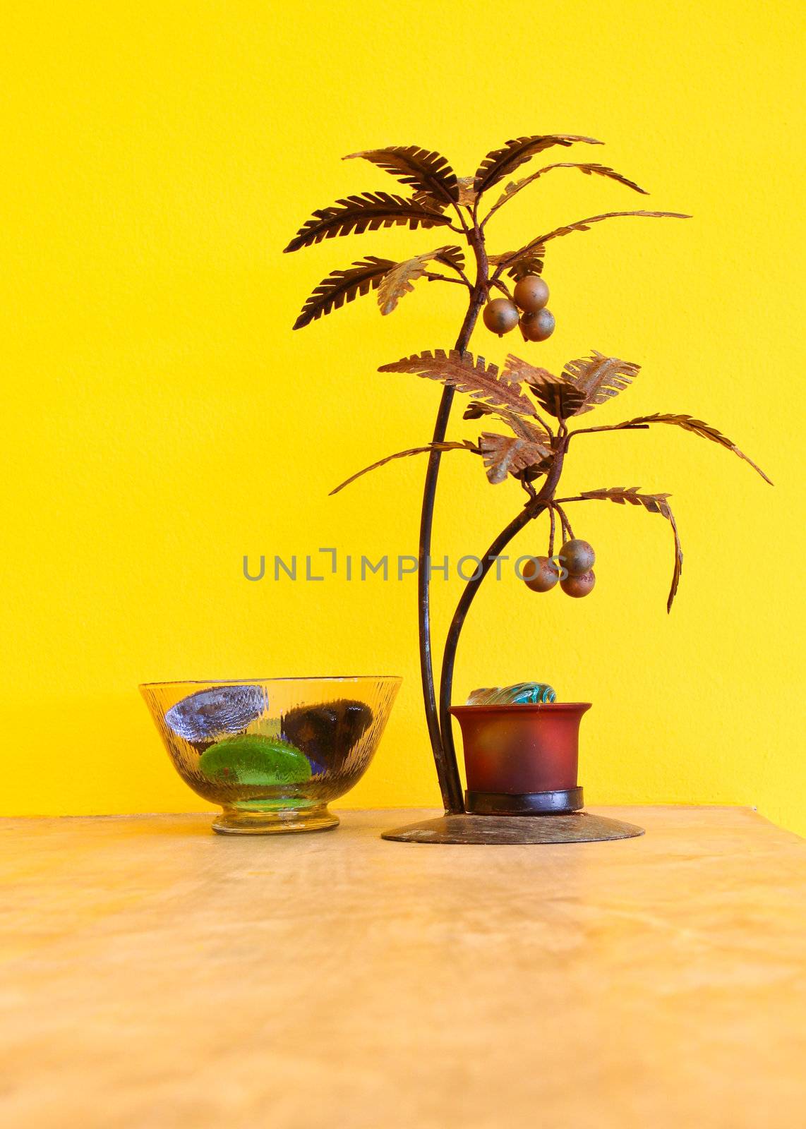 decorative metal tree with yellow wall by nuchylee