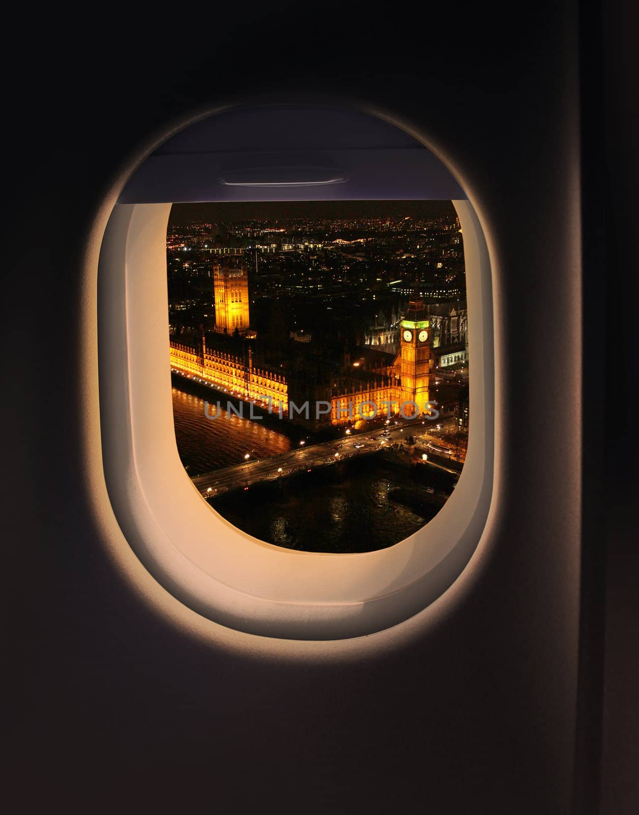 Approaching destination London UK destination, jet plane window night sky view