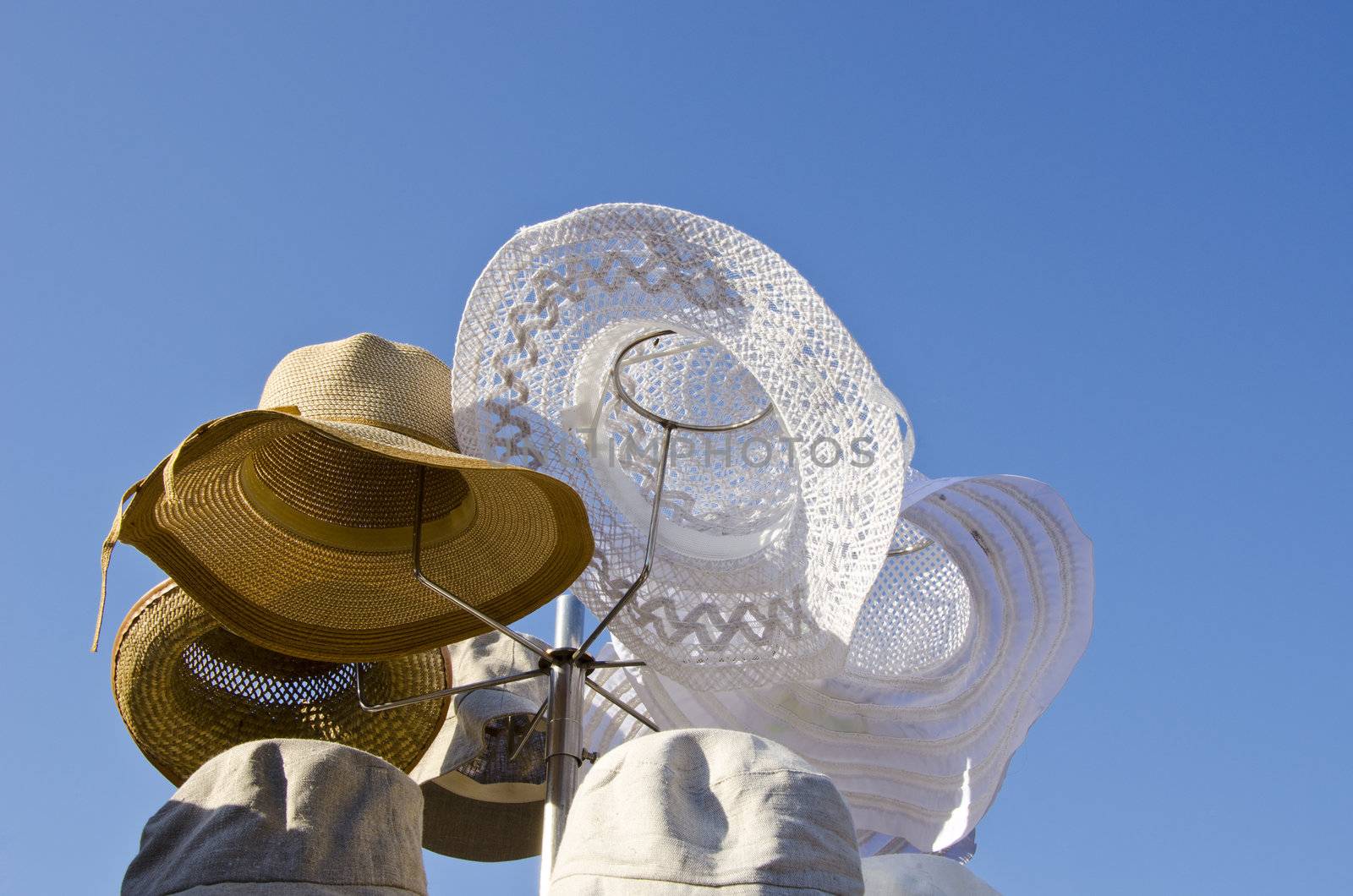 Summer hats titfer made ??from natural materials protection from sun sold at outside market fair