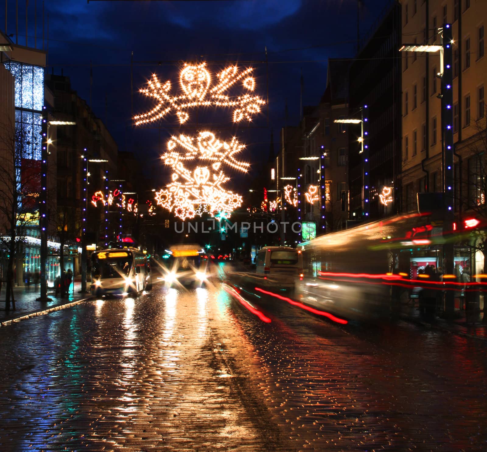 City street with Christmas light decoration and busy traffic