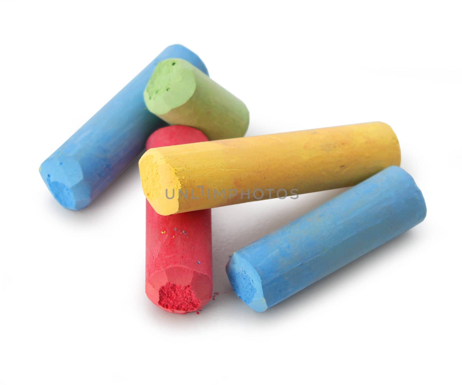 Pastel color chalks red blue yellow green isolated on white background