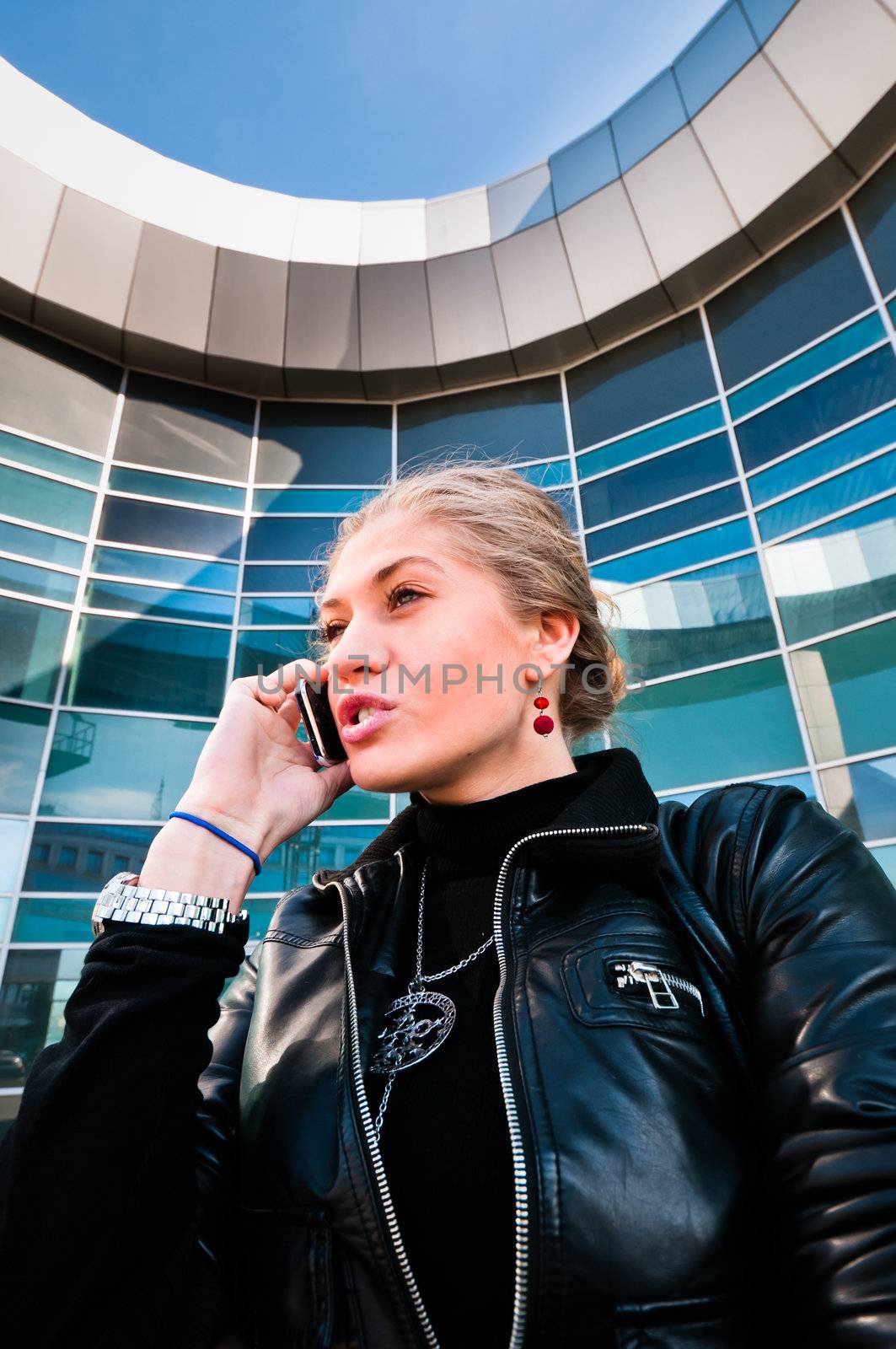 Business woman talking on the phone by dmitryelagin