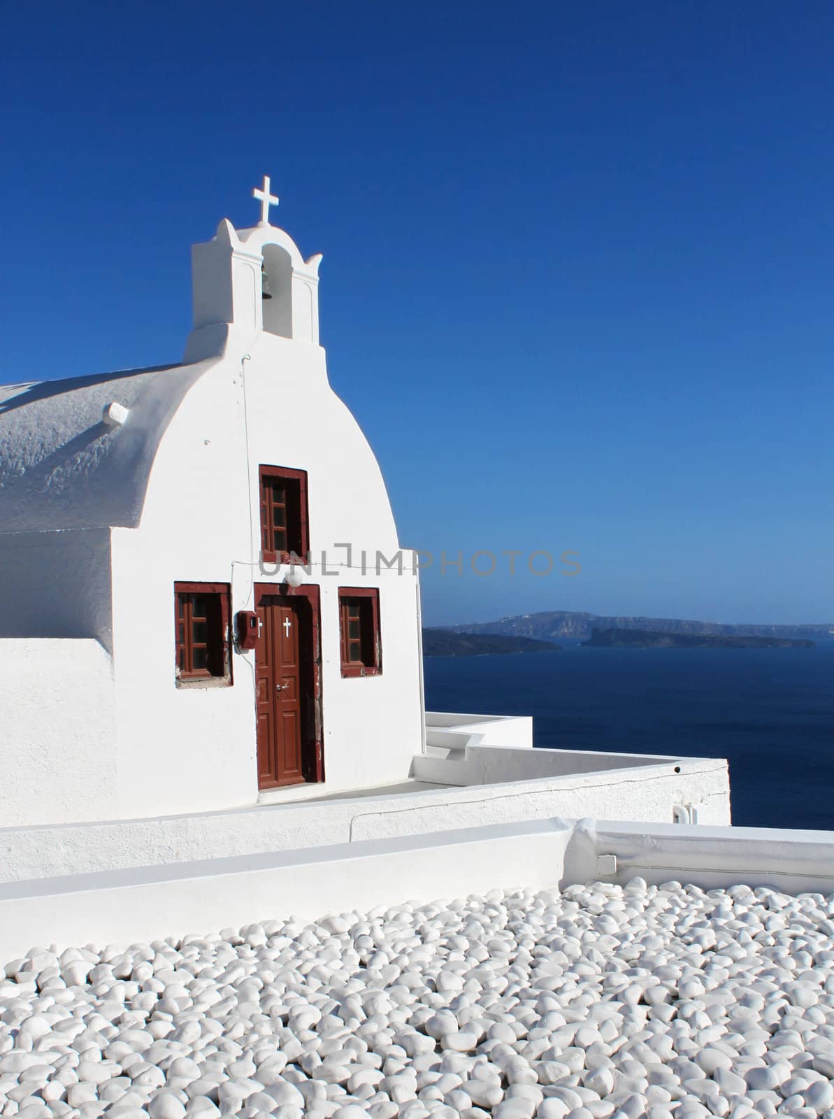 White Cycladic church, blue sky Oia Santorini Greece