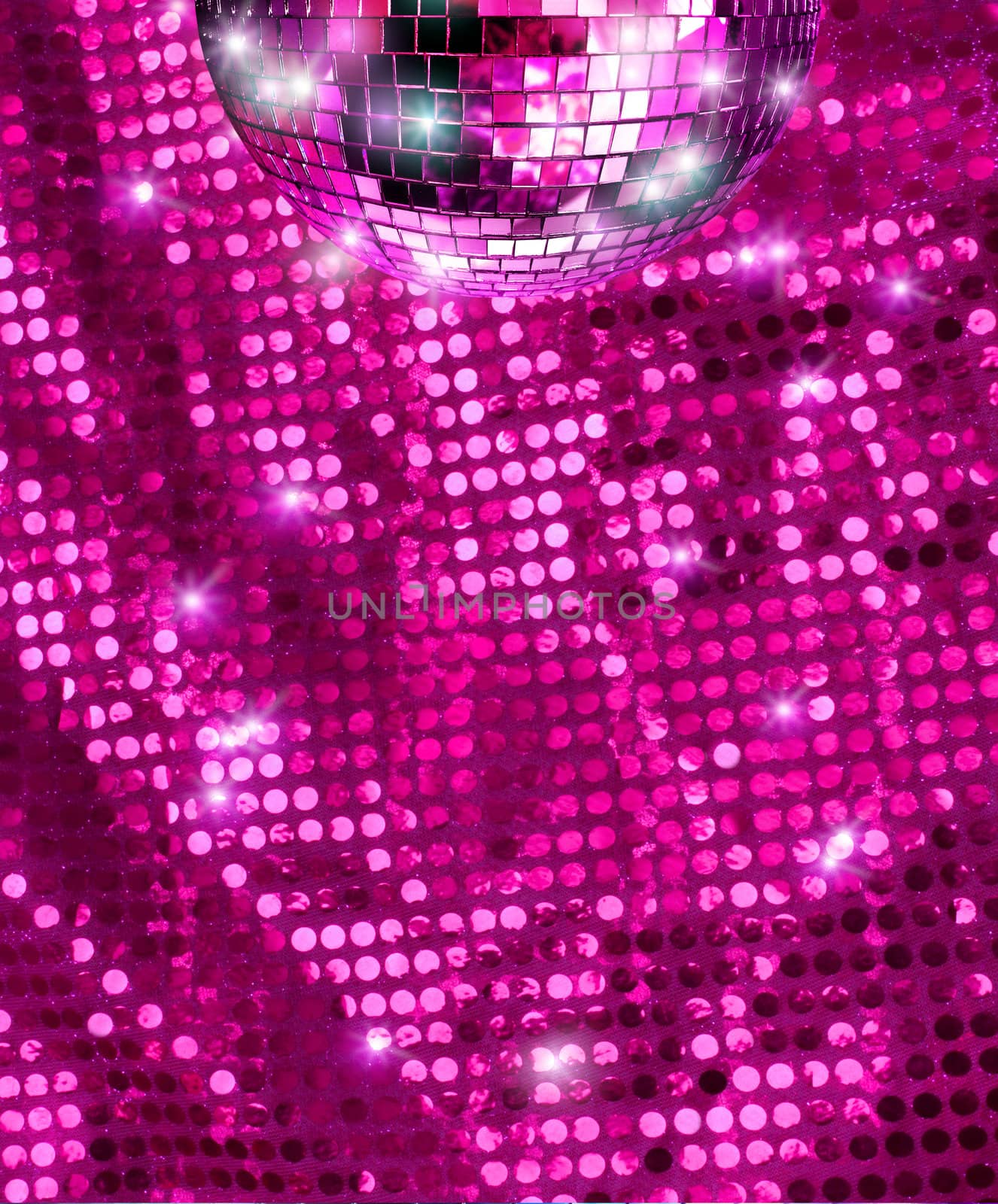Disco mirro ball  reflecting light on pink glitter background
