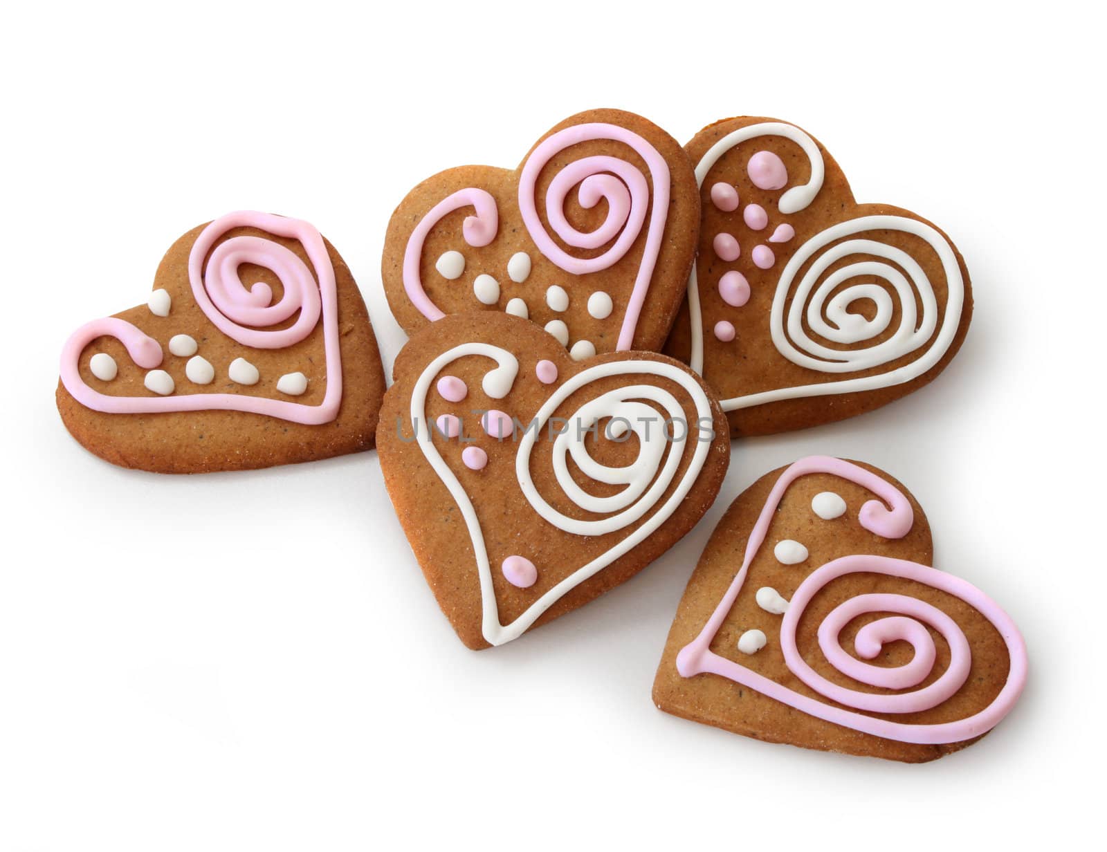 Heart shape ginger breads decorated with pink and white sugar glazi