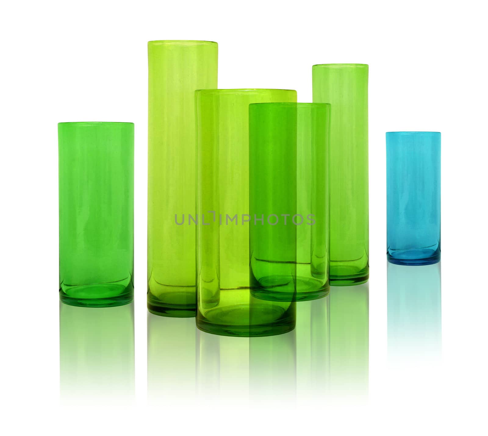 Modern colored glass vases row on white reflective background