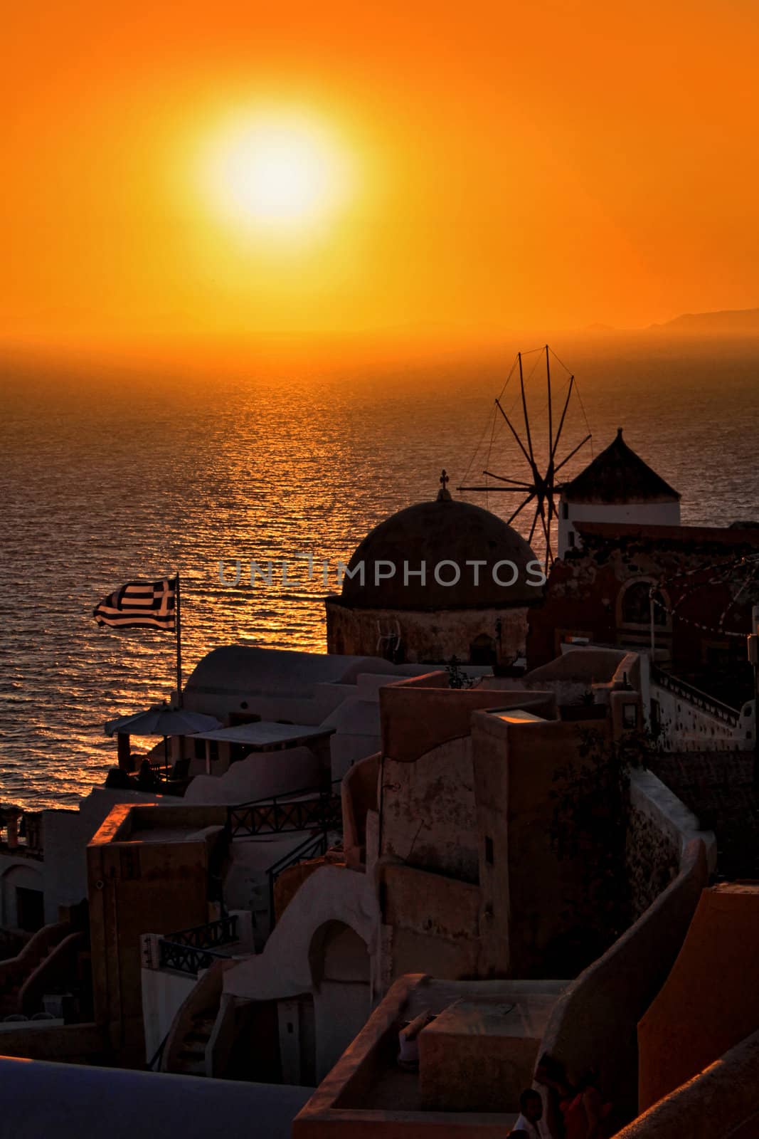 Famous sunset in Oia village Santorini island Greece