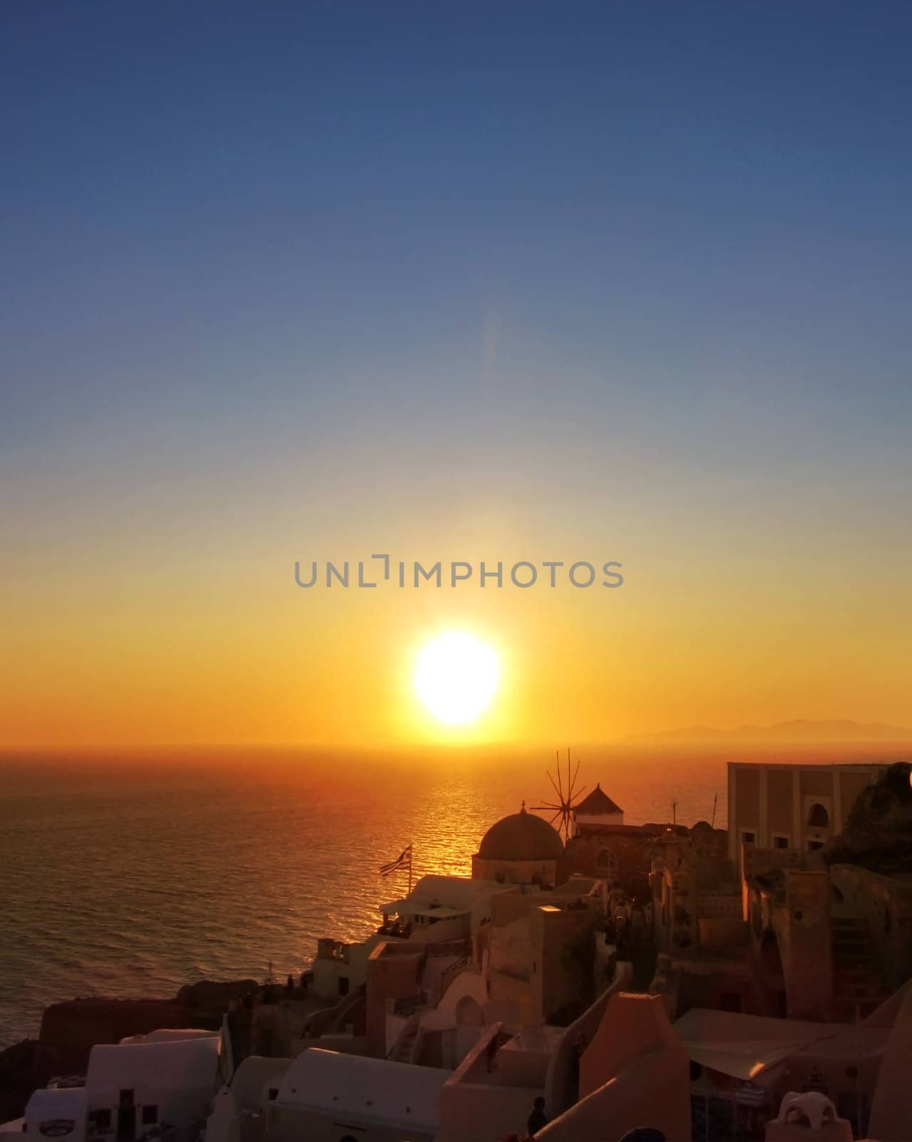 Famous sunset in Oia village Santorini island Greece