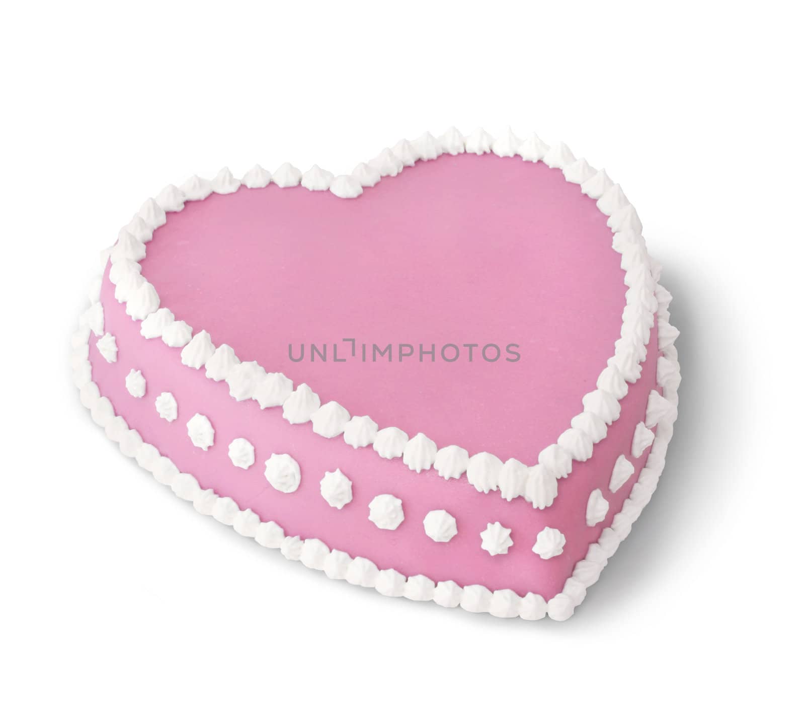 Pink heart shape marzipan cake decorated with white whipped cream