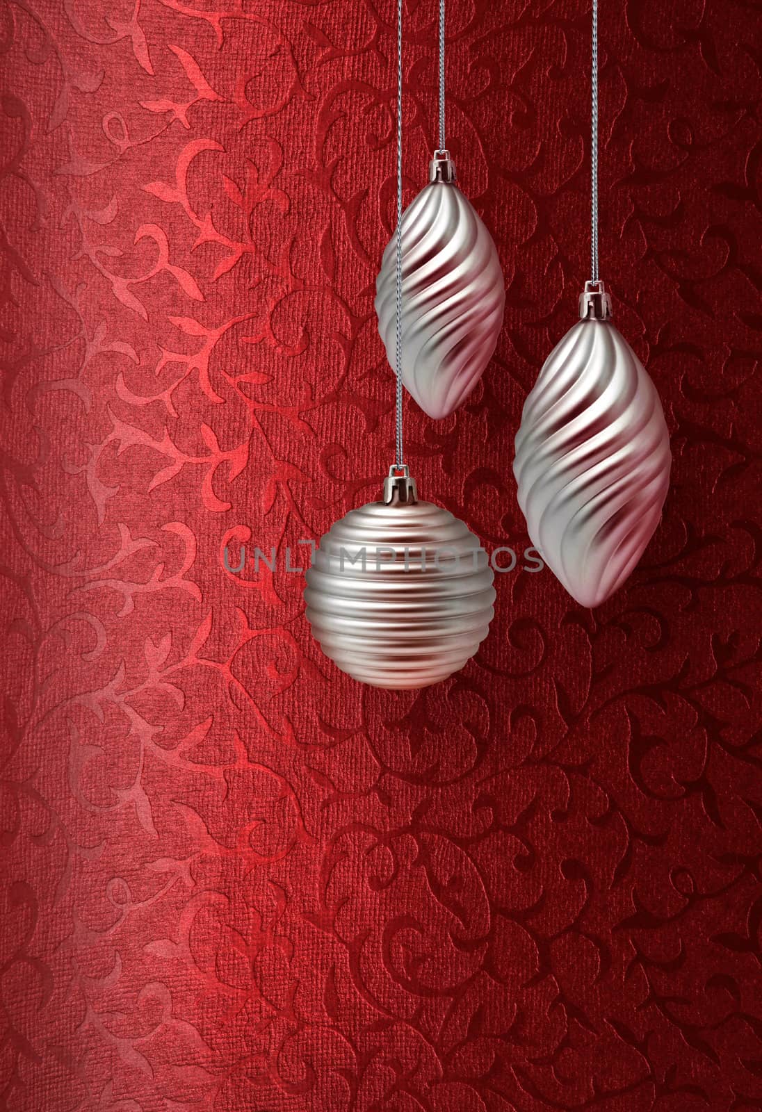 Silver Christmas decoration on vivid red brocade fabric pattern background