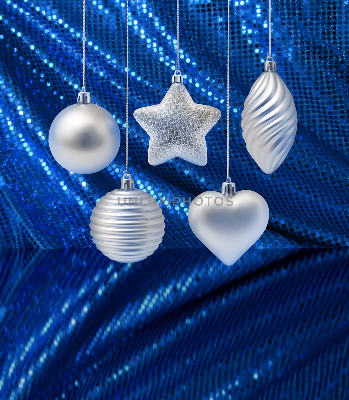 Silver Christmas decoration elements on blue glitter cuirtain background