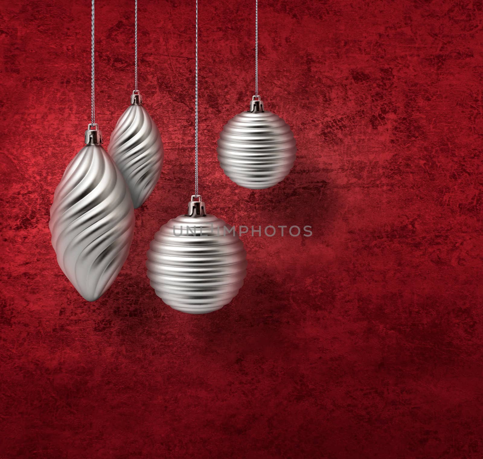 Silver Christmas decoration baubles on red textured background
