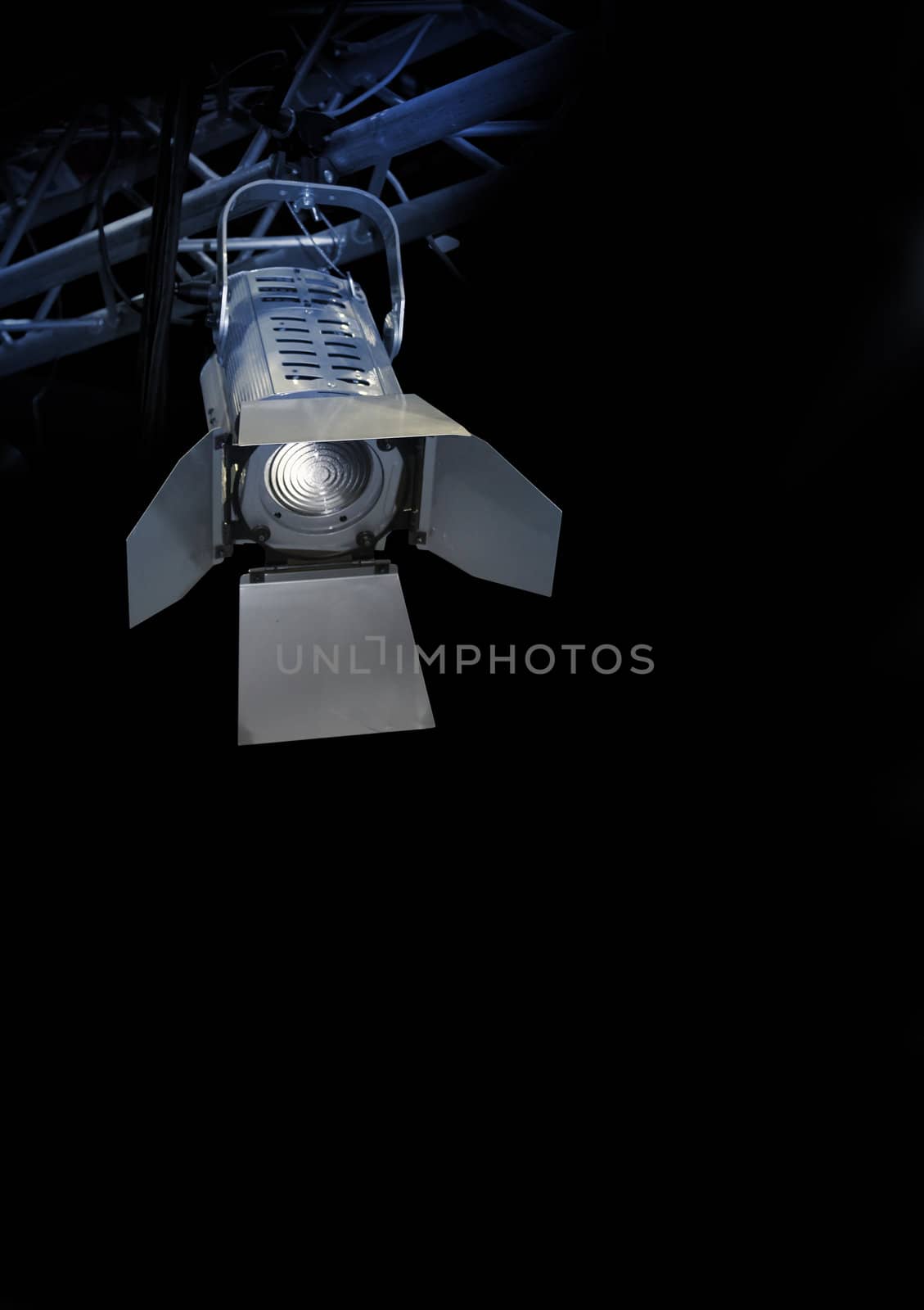 Professional stage spotlight lamp on black background