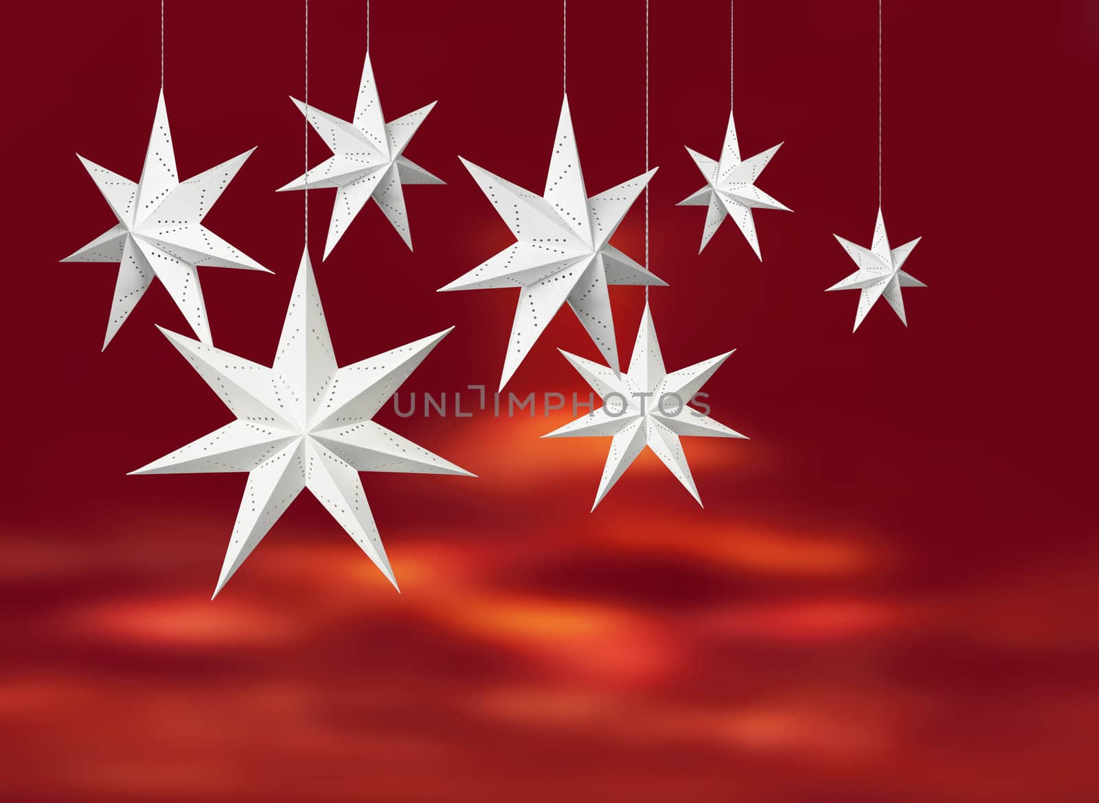 White Christmas decoration paper stars hanging on vivid red background