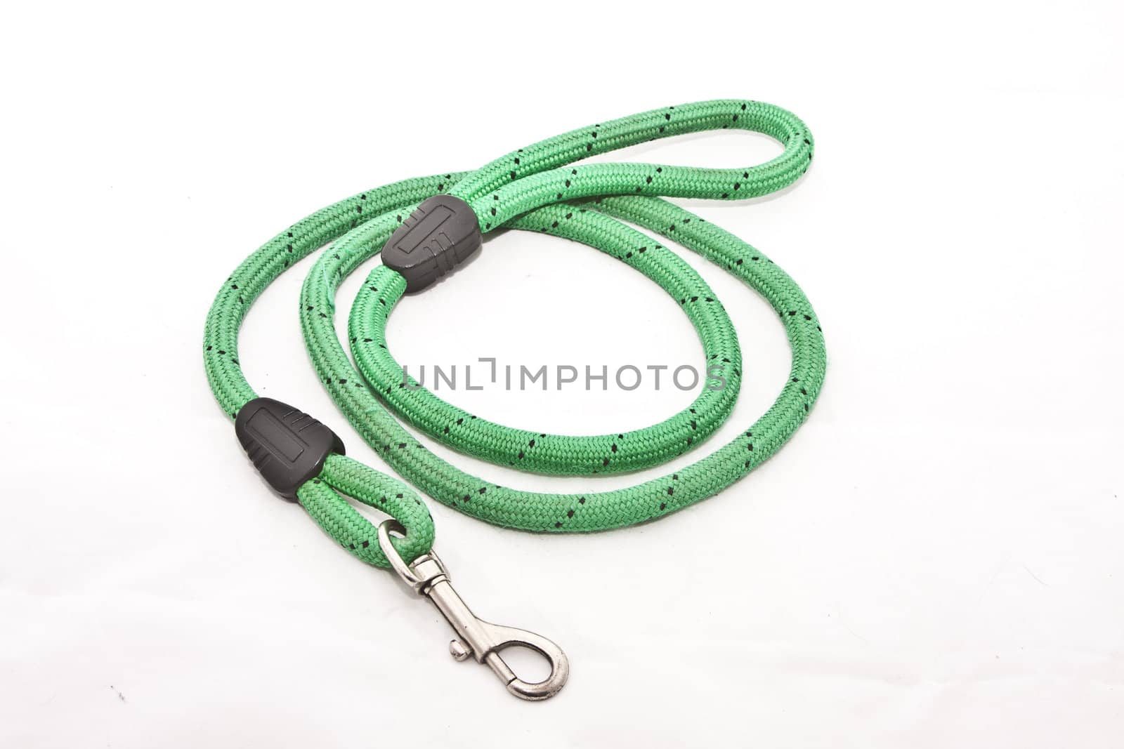 A braided dog lead over a white background
