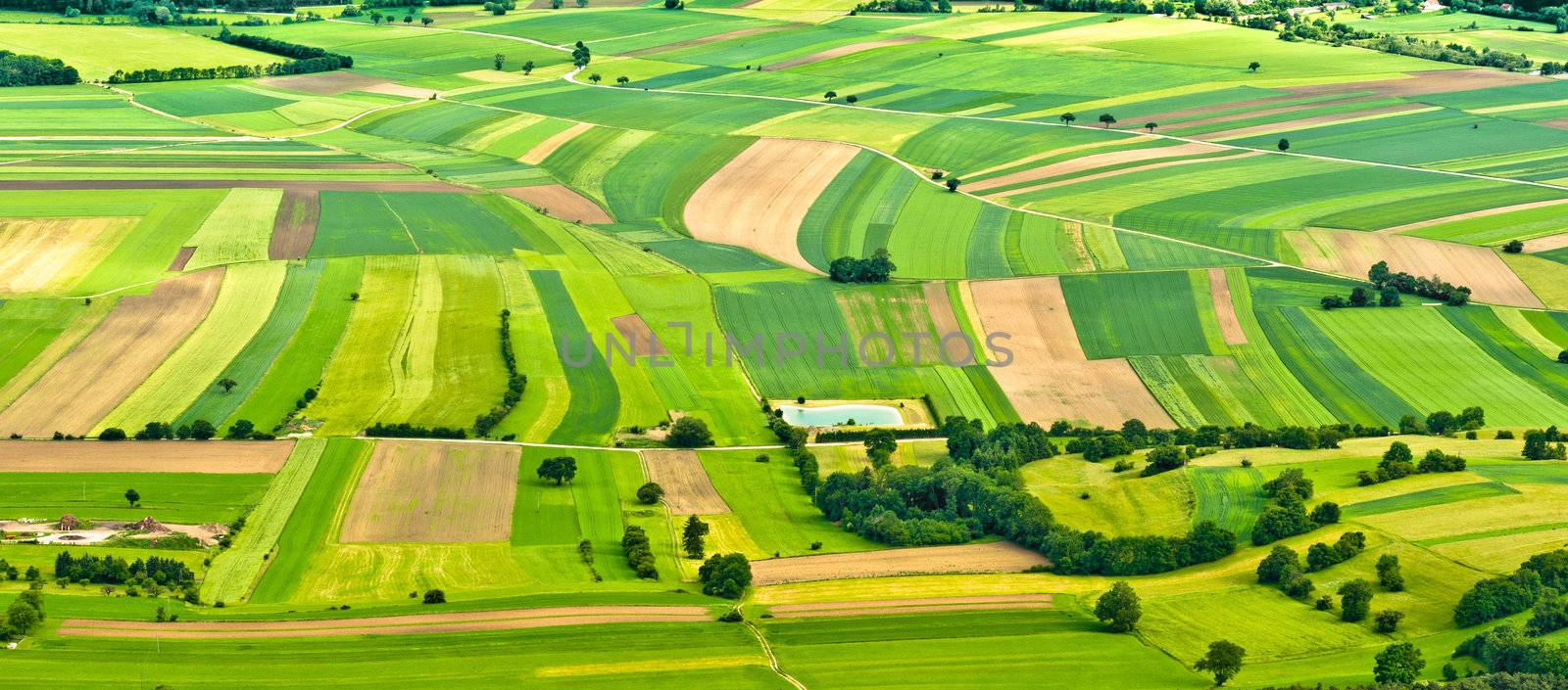aerial view of green fields and slopes