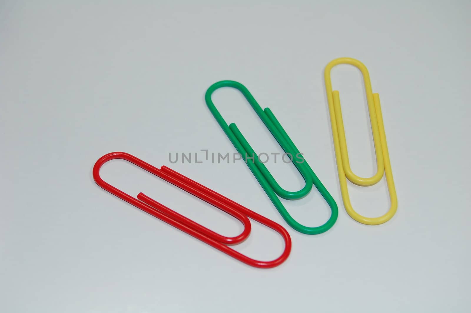 colorful paper clips isolated