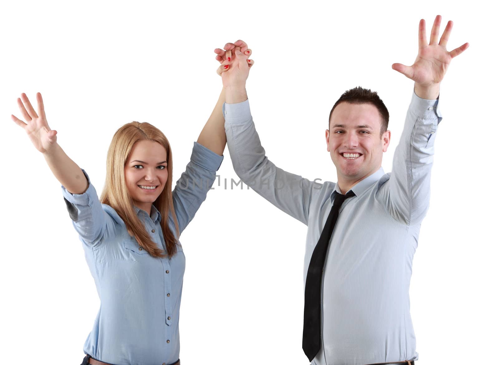 Young couple celebrating their success with hands raised isolated against a white background.