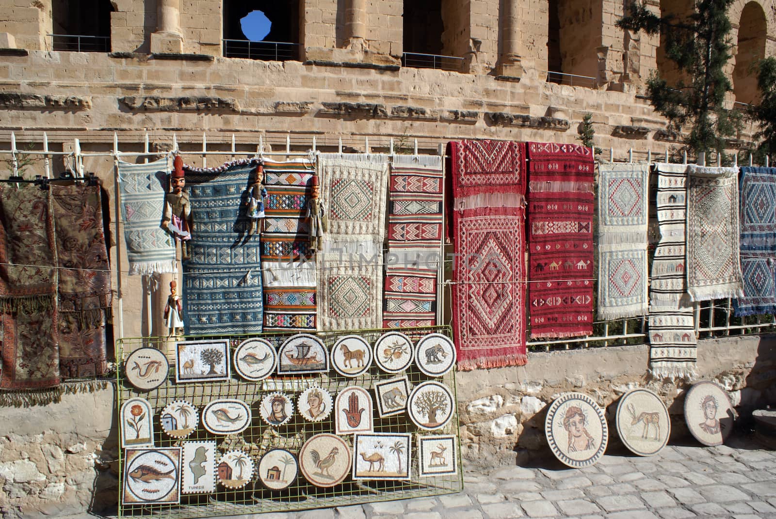 Souvenirs near the wall of roman theater in El-Jem, Tunisia         