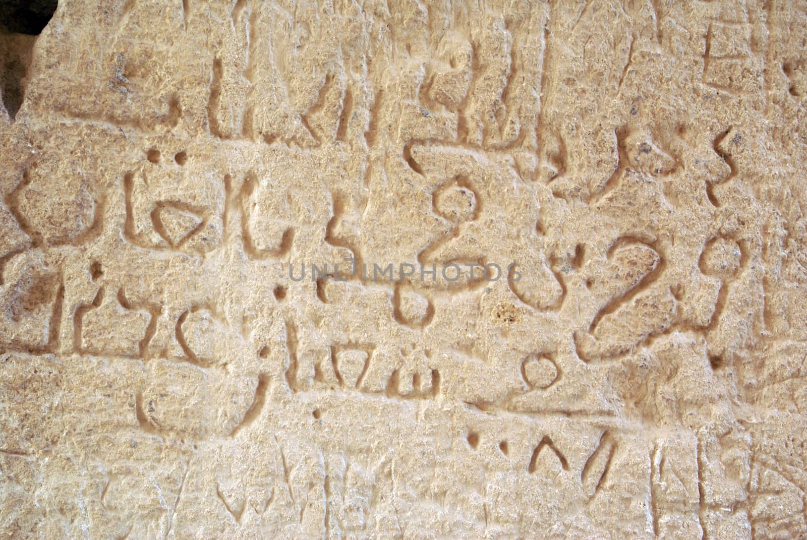 Arabic graffiti on the stone of roman theater in El0Jem, Tunisia                 