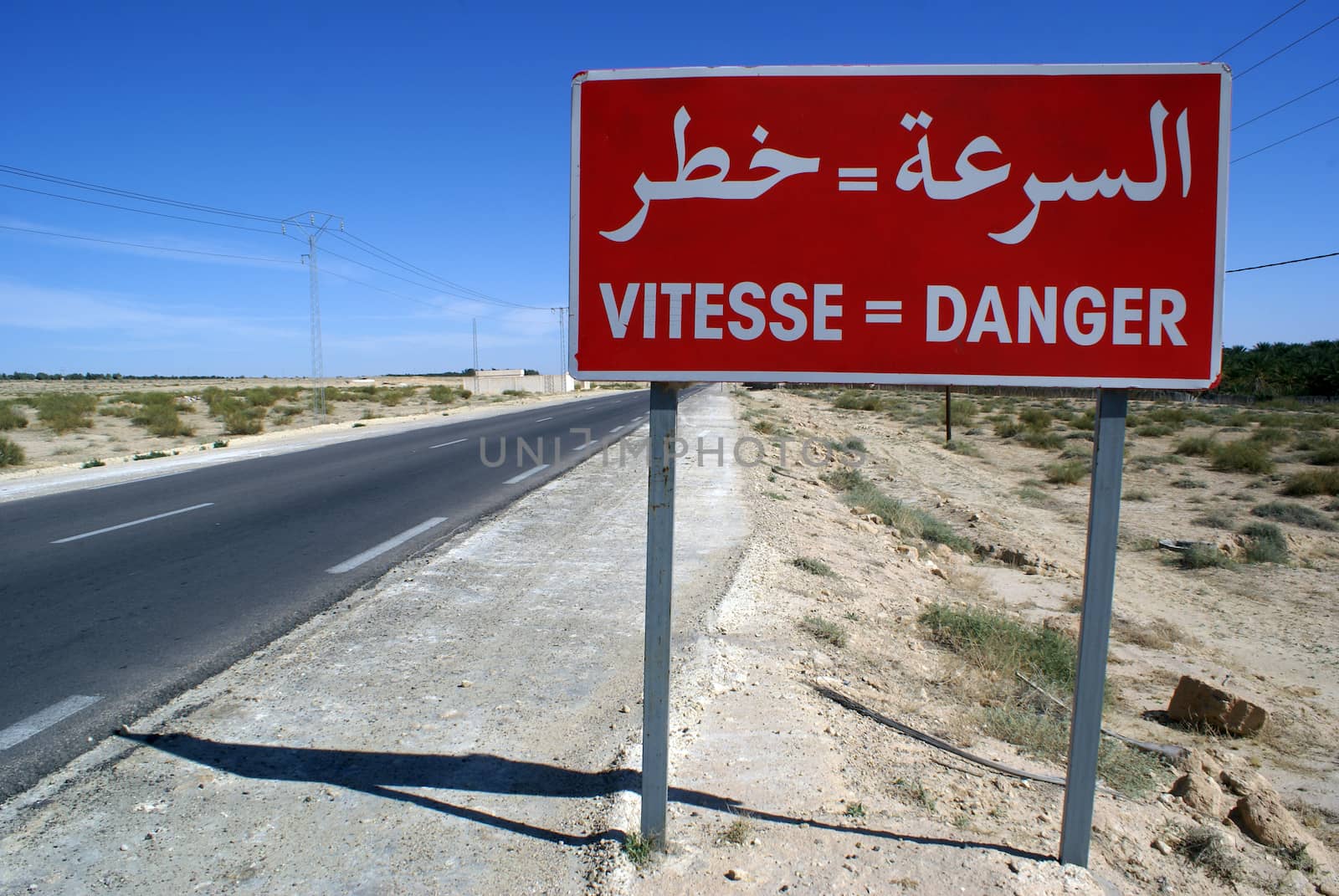 Red sign danger on the road in south part of Tunisia                