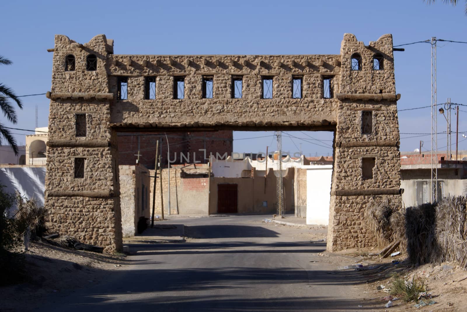 Gate on the road to old medina Kebili, Tunisia               