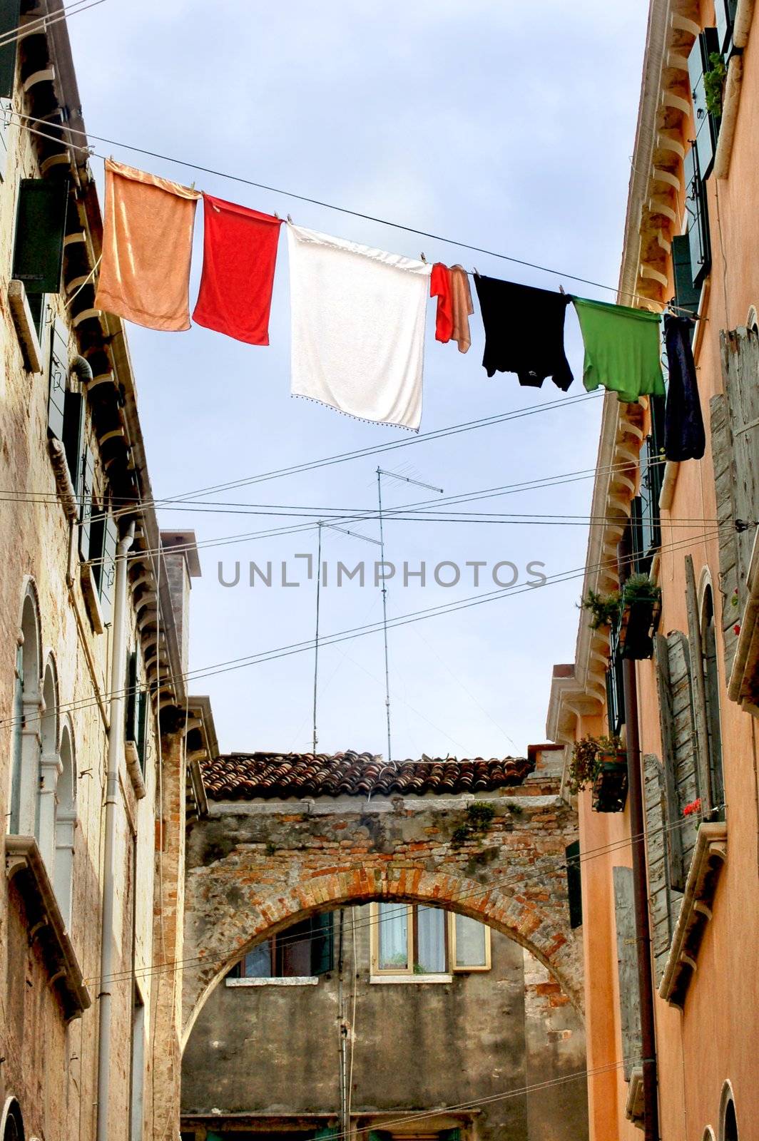Fresh laundry hanging between two houses in venice