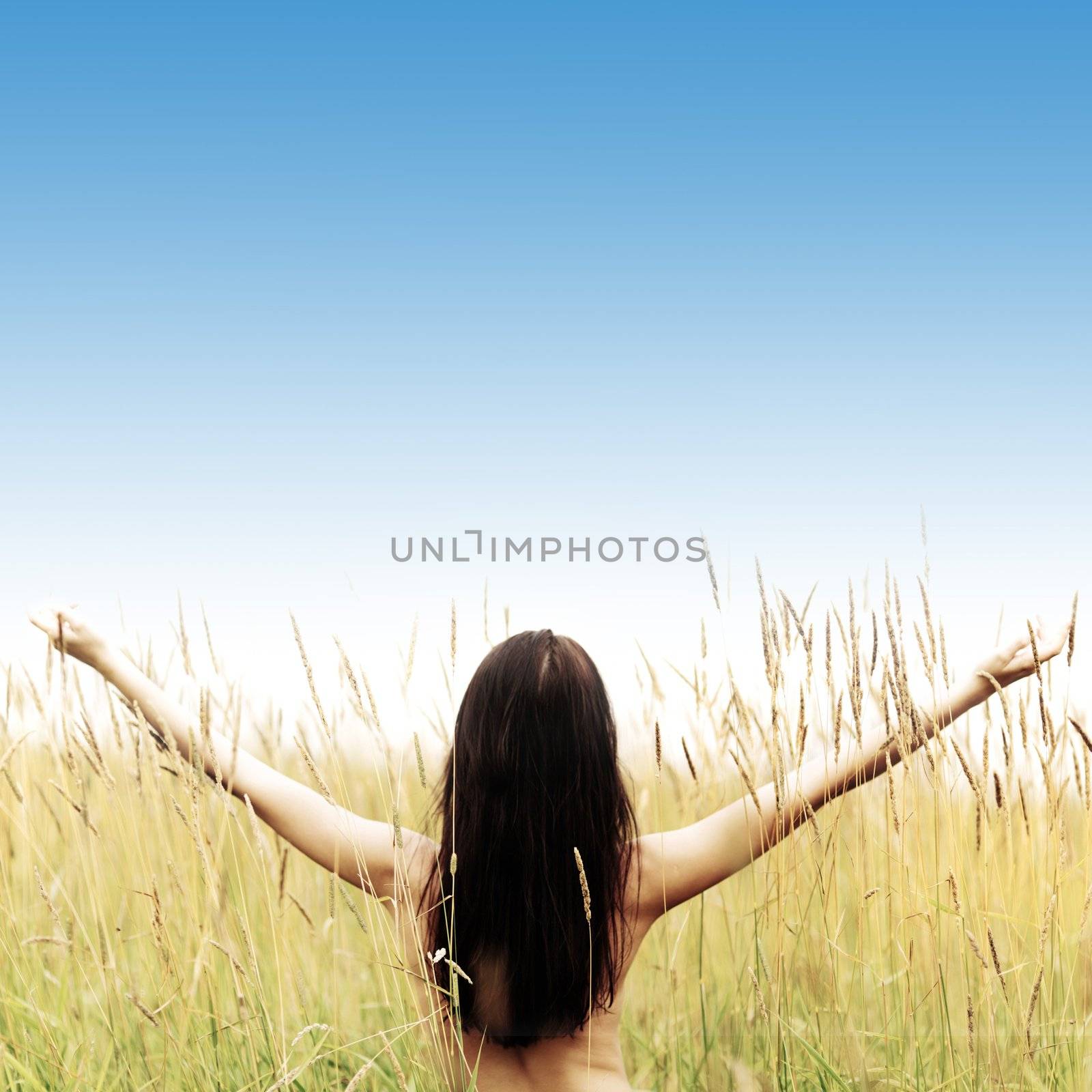 woman on grass field feel freedom