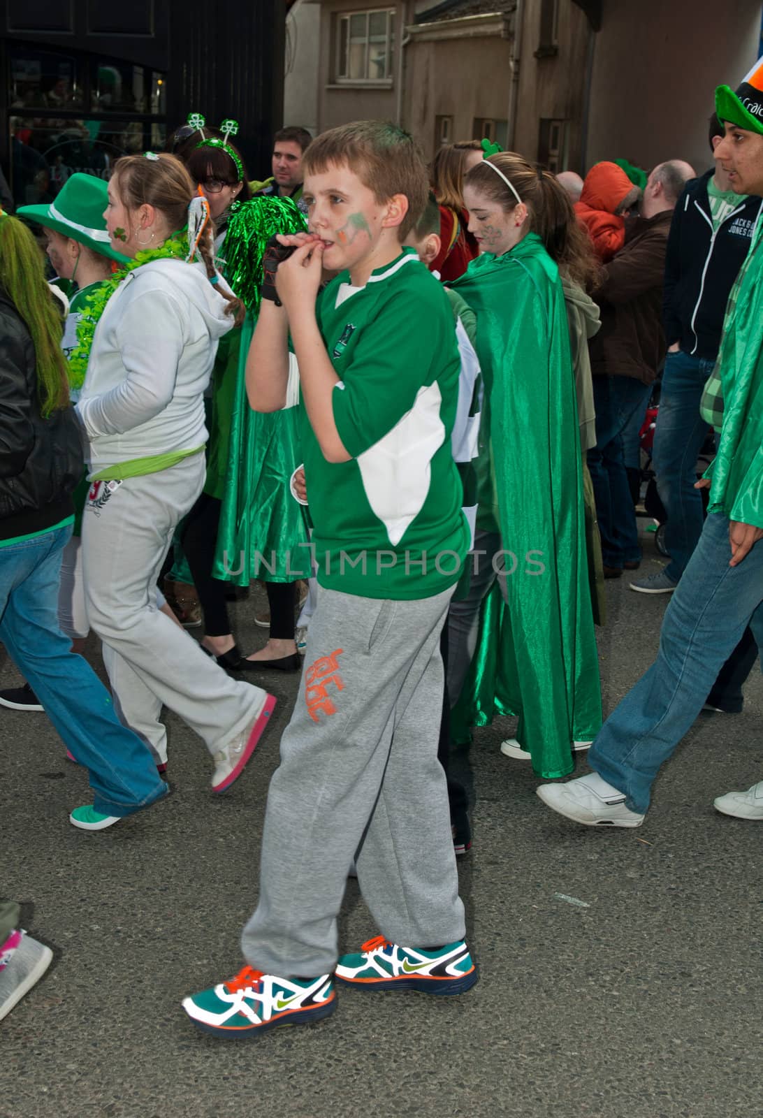 MALLOW, IRELAND - MARCH 17: unidentified children perform at the St. Patrick's day on March 17, 2012 in Mallow, Ireland. This national Irish holiday takes place annually in March, event was held during the afernoon of March 17th 2012.