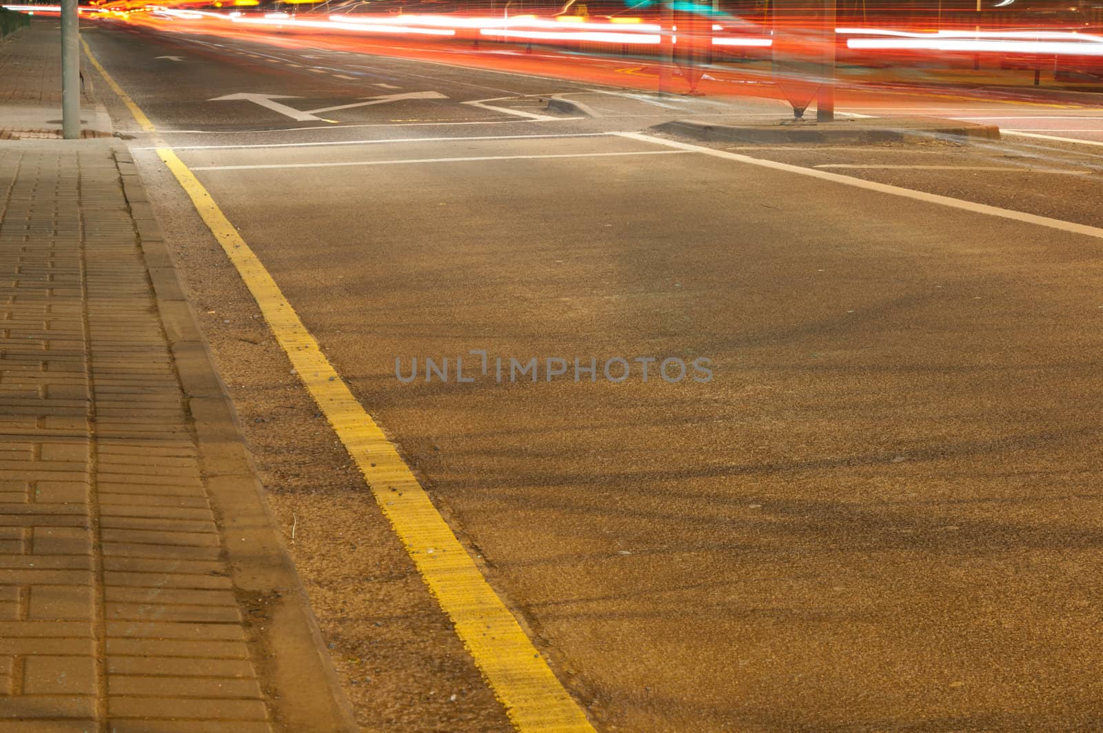 night traffic on a urban road with car trails (long exposure)