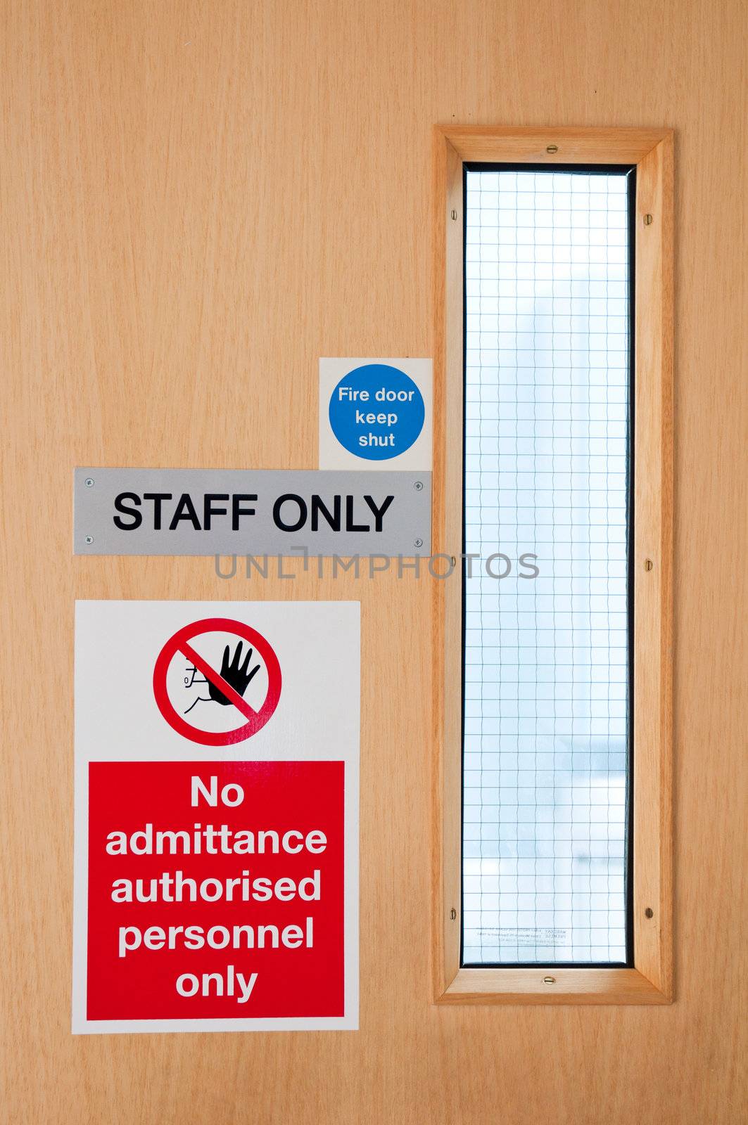 staff only door signs outside laboratory room to assure health and safety in the workplace