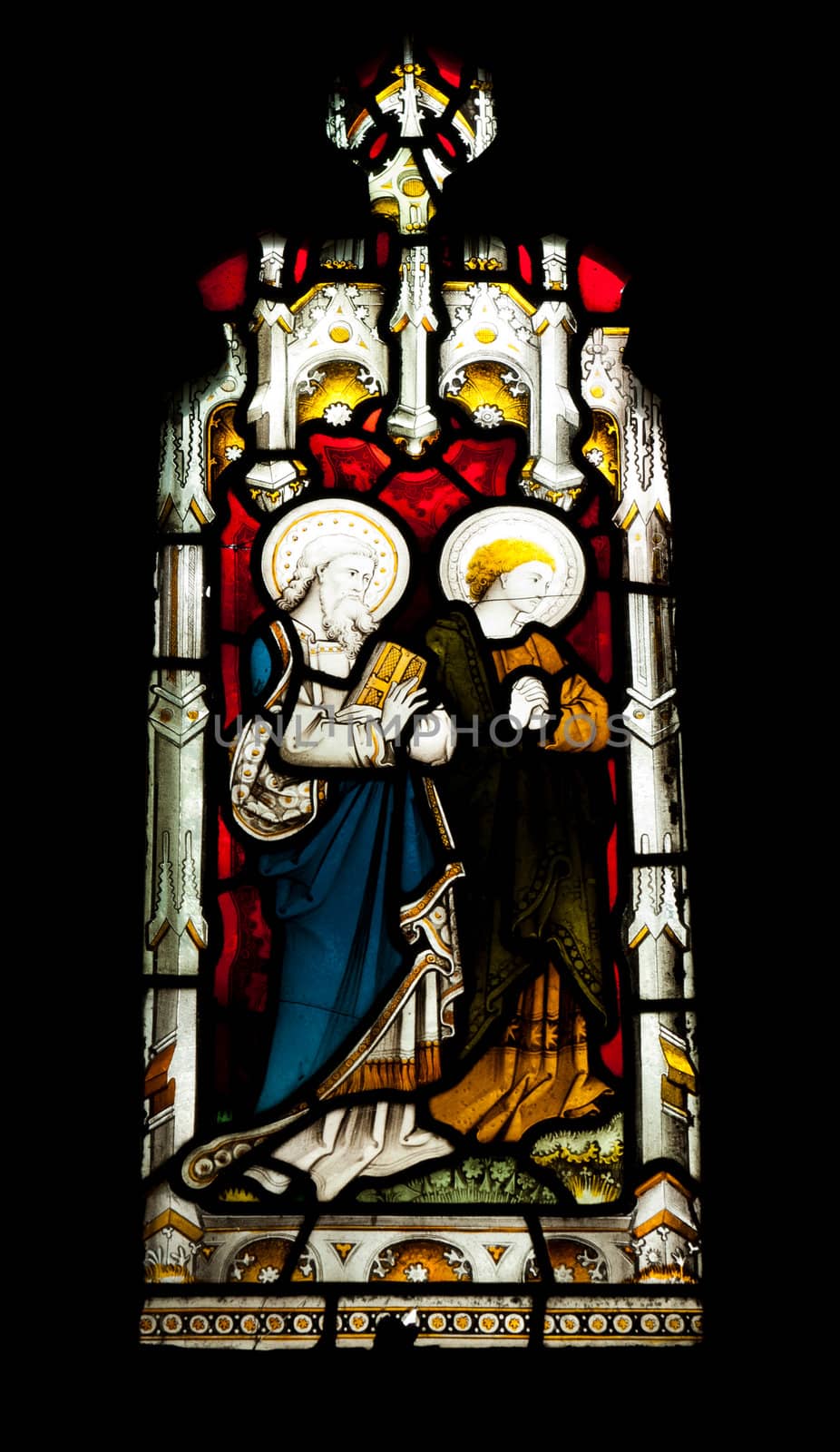 religious stained glass window in Gloucester Cathedral, England (United Kingdom) (isolated on black background)