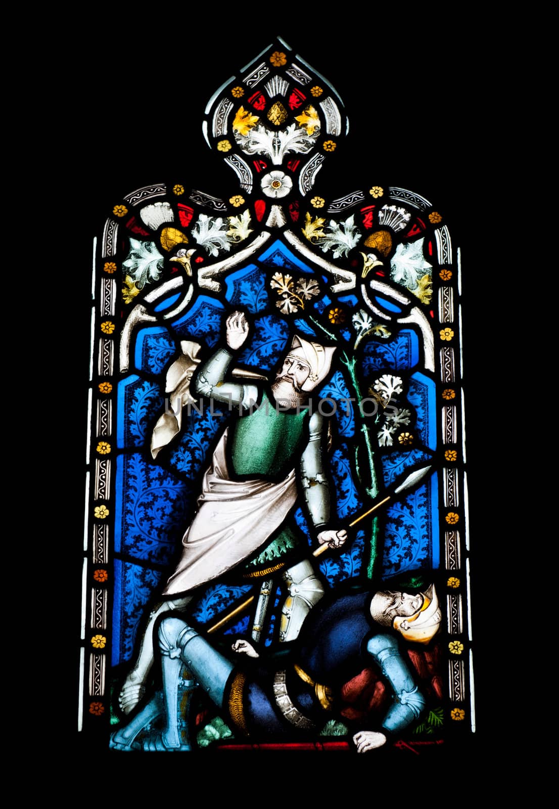 religious stained glass window in Gloucester Cathedral, England (United Kingdom) (isolated on black background)