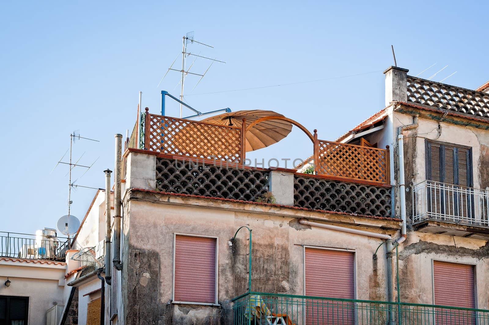 Old house with antennas on the roof, taien in naples, italy