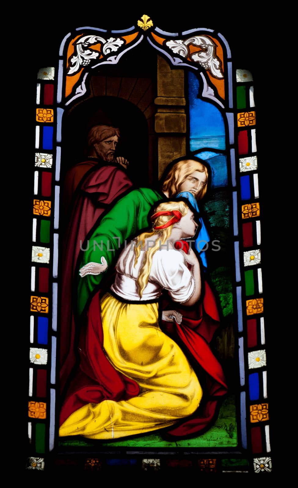 religious stained glass window in Gloucester Cathedral, England (United Kingdom) (isolated on black background)