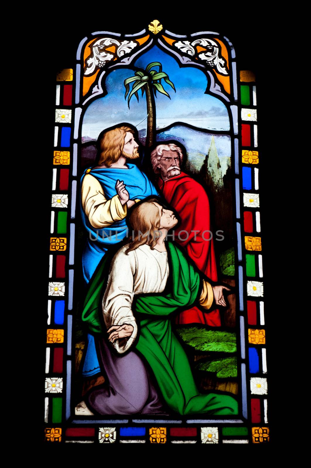 religious stained glass window in Gloucester Cathedral, England (United Kingdom) (isolated on black background)