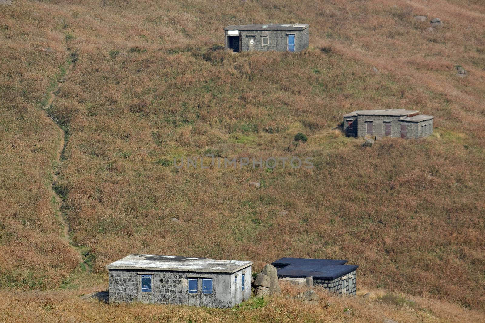 old stone house with grass on the mountain 