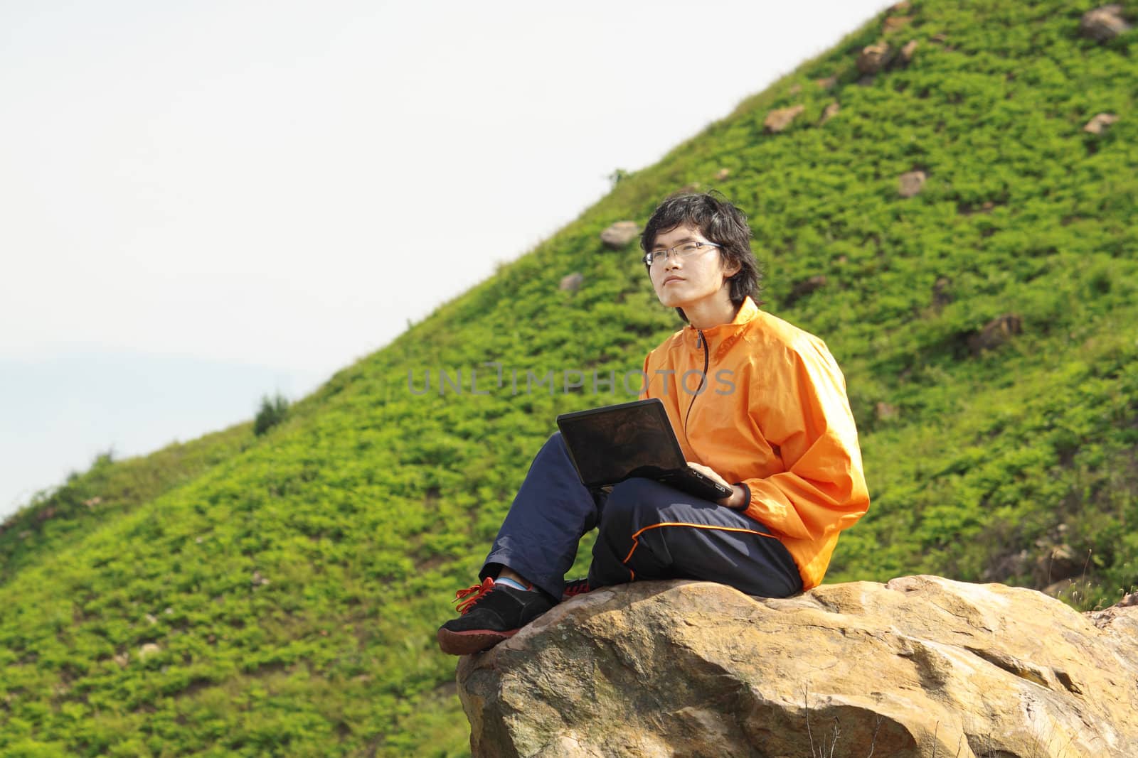 asain Man with notebook at day