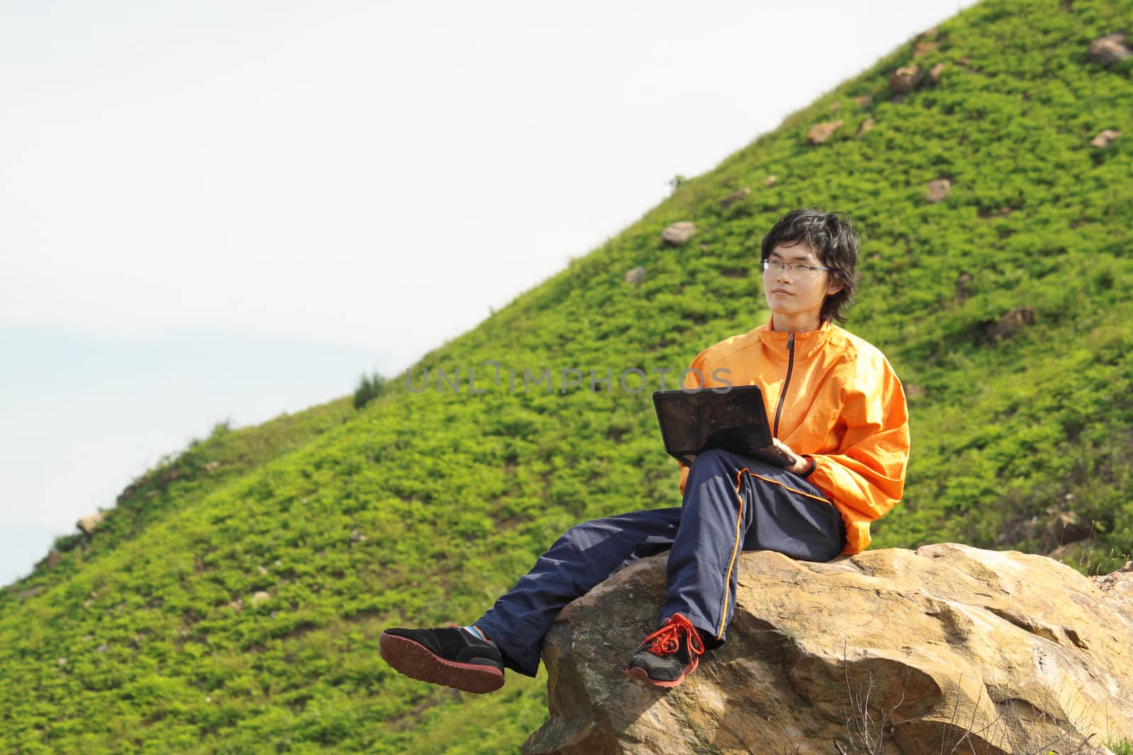 asain Man with notebook at day