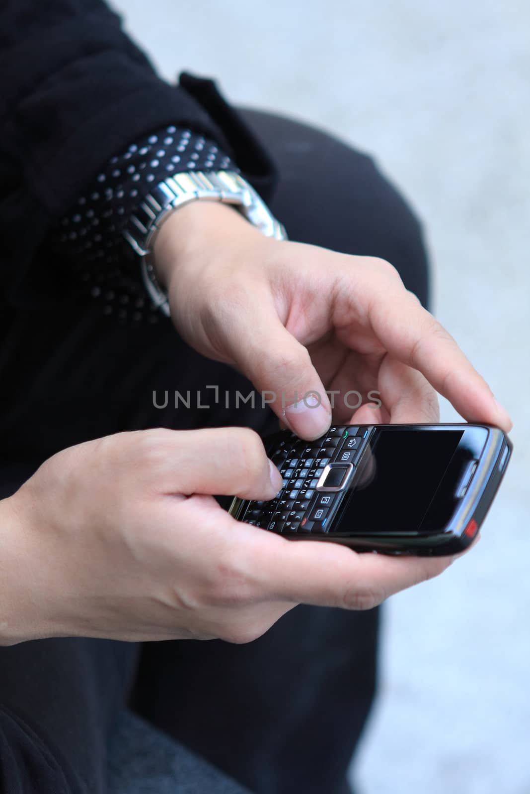 Mobile phone in man hand by cozyta